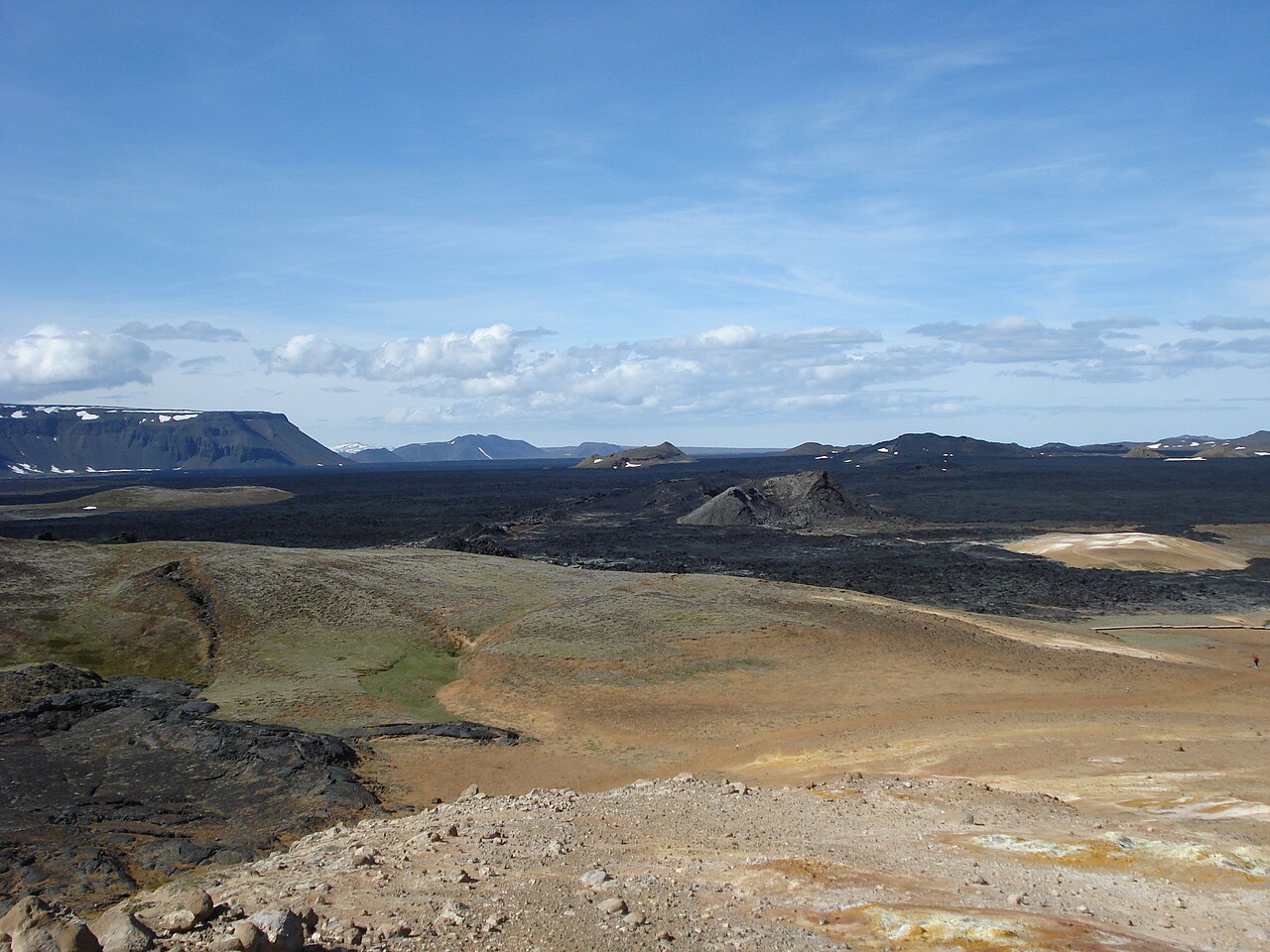 Steam and black volcanic terrain at Leirhnjúkur