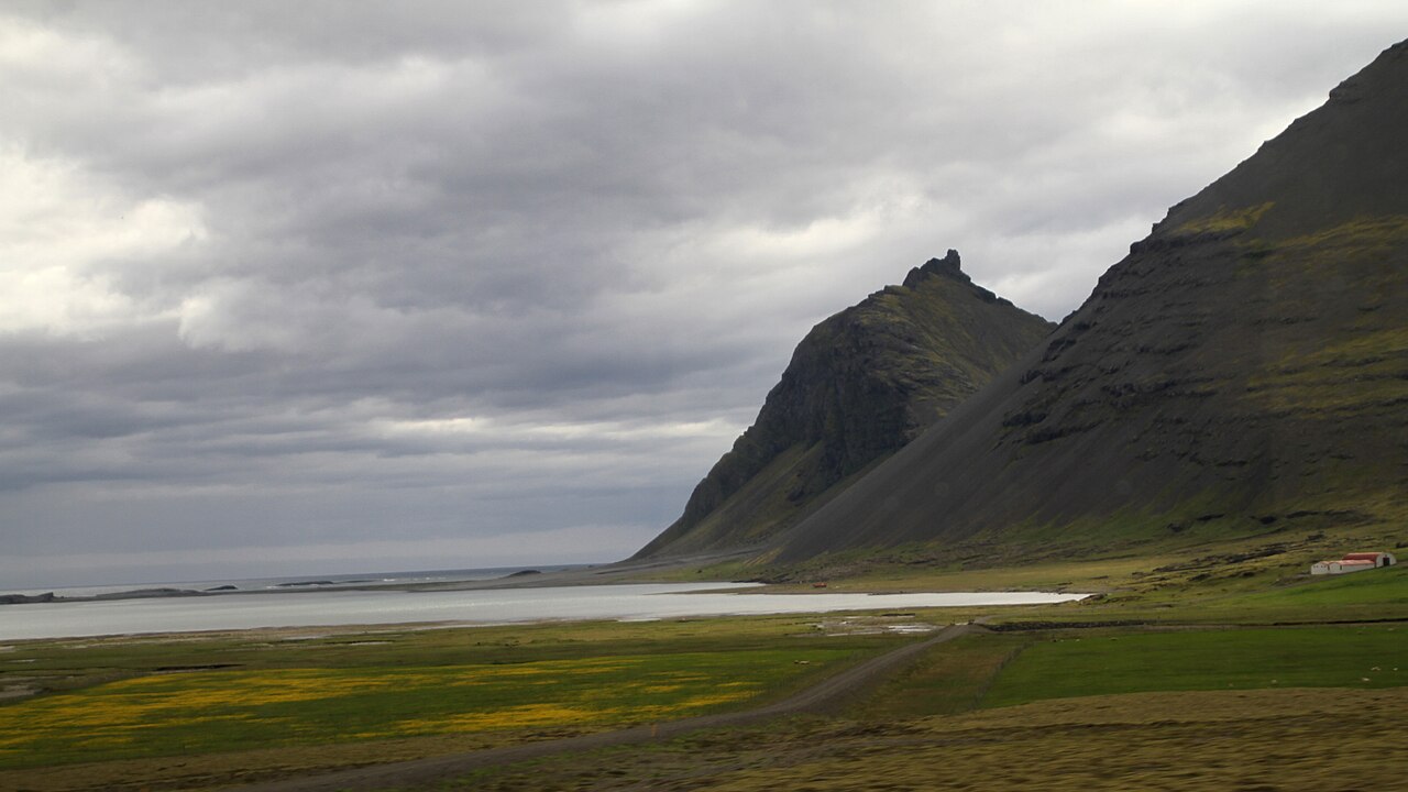 Jagged Vestrahorn mountain behind black sand